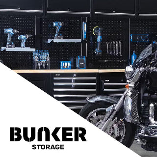 Motorcycle parked next to a storage unit with tools and equipment, featuring the 'Bunker Storage' brand.